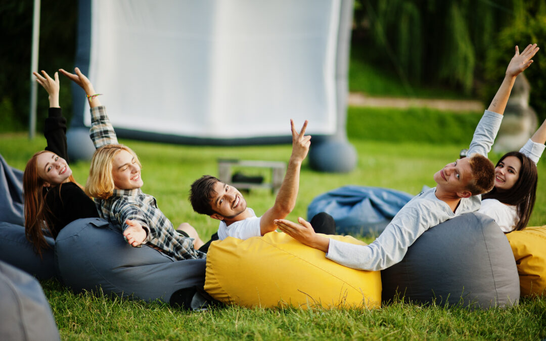 kidulting a man and two women sitting on bean bag chairs