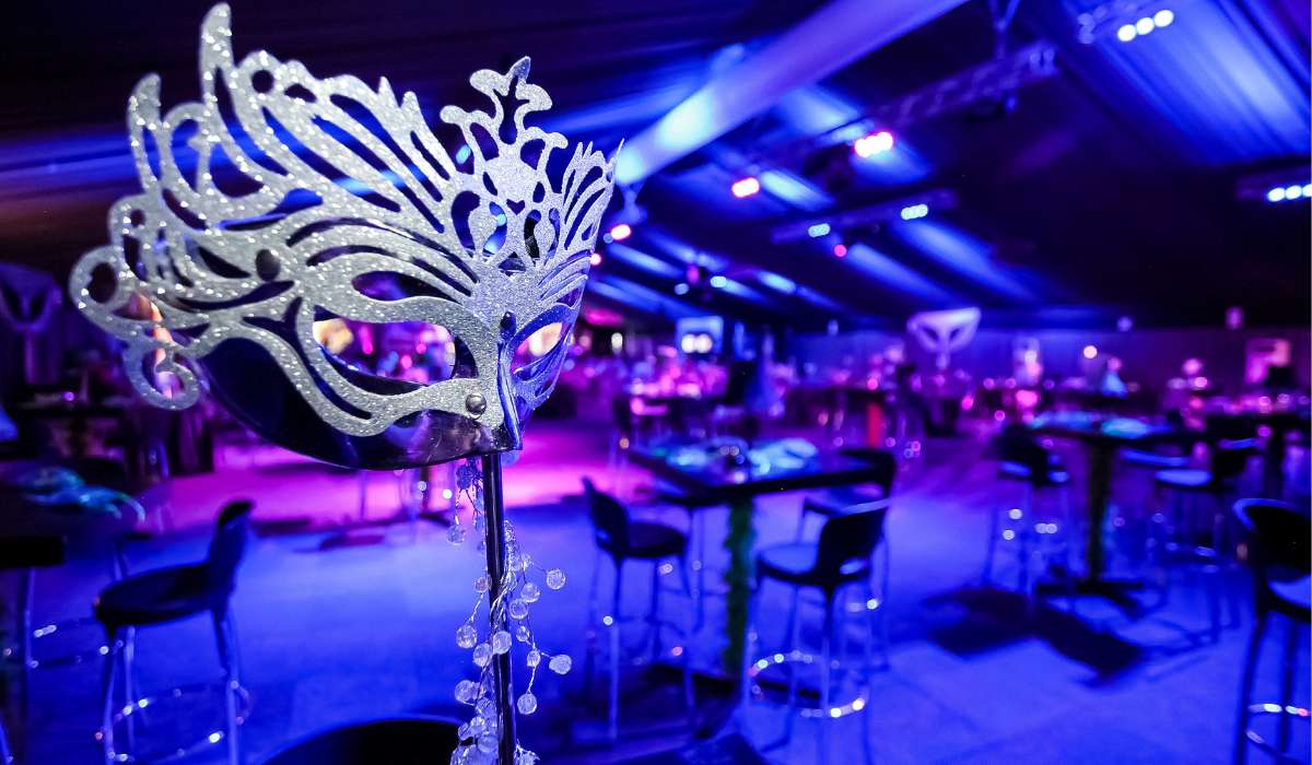 a masquerade mask sitting on top of a table