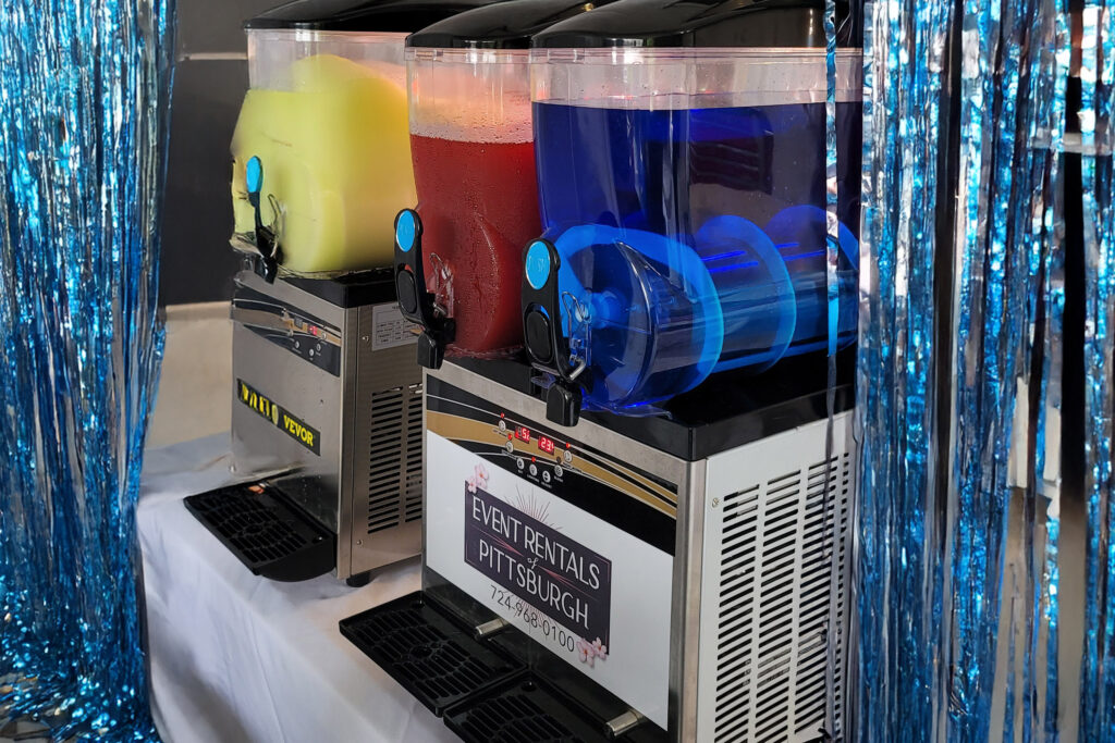 a table topped with drinks and a machine
